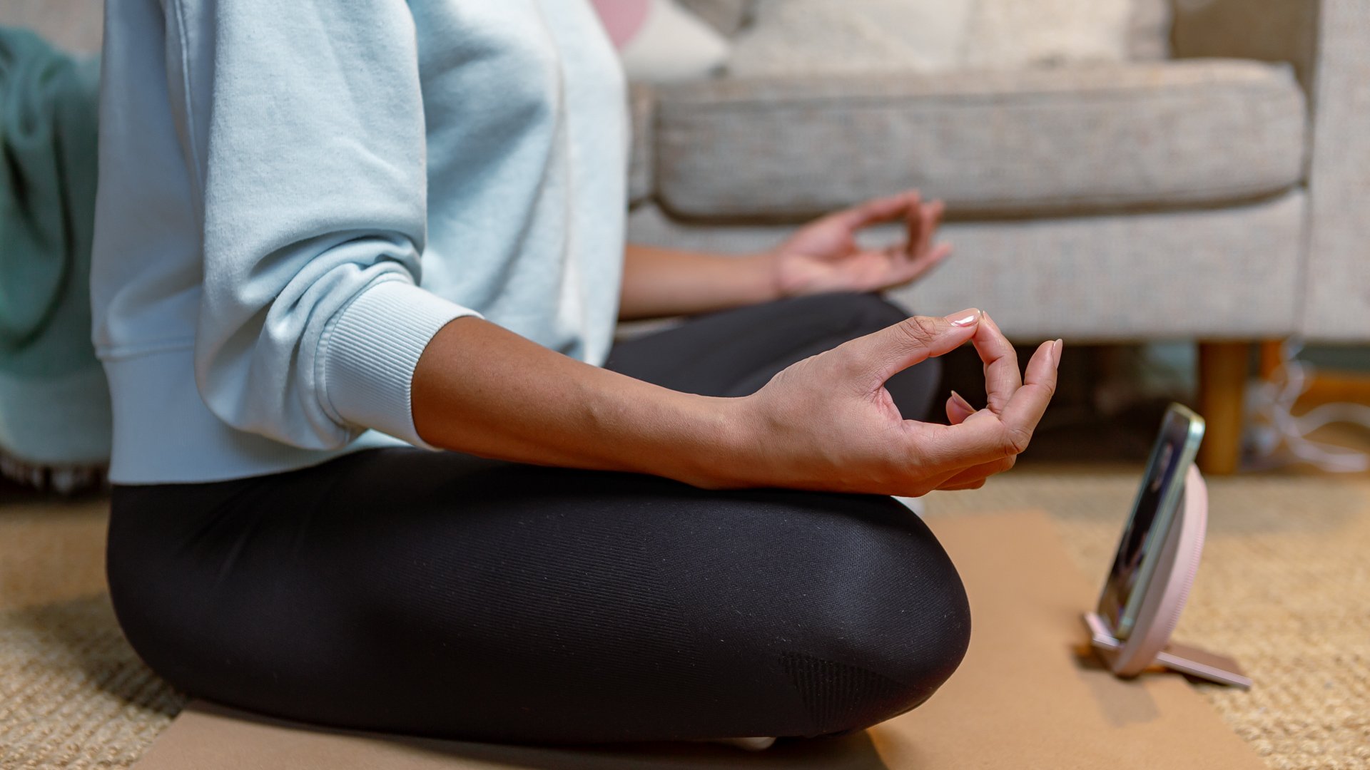 person meditating using the MindLabs app